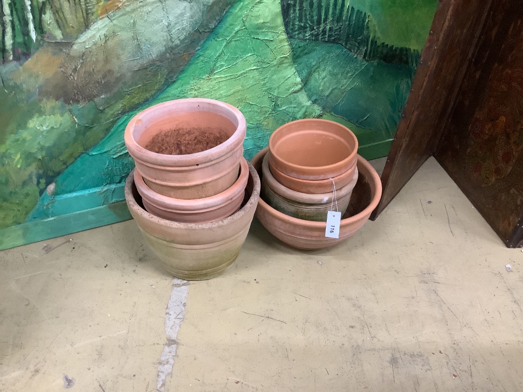 Seven various terracotta garden planters, largest 40cm diameter